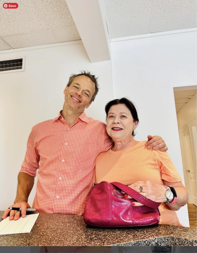 Dr. Richard Houghton with a longtime patient at the Function Health Clinic front desk
