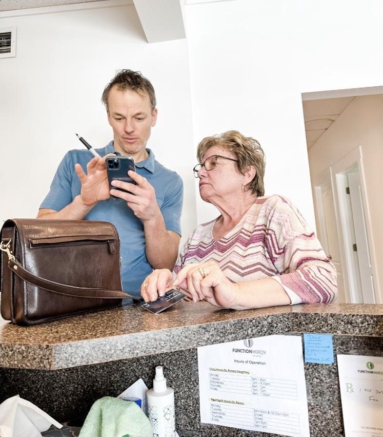 Dr. Richard Houghton connecting with a patient between appointments
